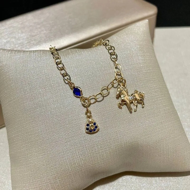 Pulseira Nossa Senhora e Cavalo Azul